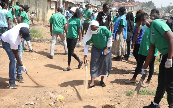 Sr. Celine Makario of the Sisters of Mary Kakamega leads a collective of youth from different technical training institutes in an environmental community service exercise that involved garbage collection, tree planting, and cleaning efforts at the Raila Village in Nairobi’s largest slum, Kibera. (GSR photo/Wycliff Peter Oundo)