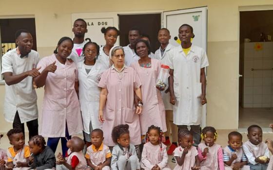 The local community holds a farewell party for Sr. Maria João Prudência (center) before she leaves Benguela, Angola. (Courtesy of Our Lady of Fatima's Sisters of Reparation)