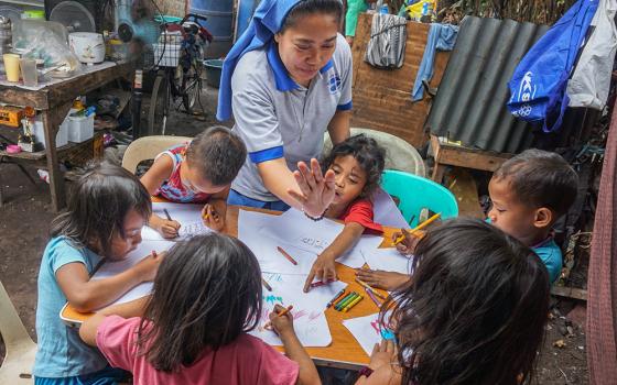 Salvatorian Sr. Cyrel Peralta is the book reading program and advocacy coordinator for the Salvatorian Pastoral Care for Children program in Metro Manila, the Philippines. The program's mobile library for book reading on the Gospel and children's rights has toured communities regularly since it began in 2004. (Courtesy of Salvatorian Pastoral Care for Children)