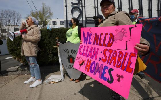 Housing rights activists and tenants protest against evictions and the poor condition of their apartments outside the offices of the landlord Broadway Capital in Chelsea, Mass., April 25, 2022. (OSV News/Reuters/Brian Snyder)