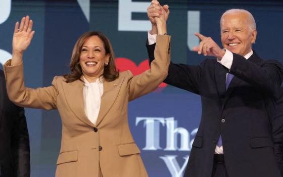 U.S. President Joe Biden and Democratic presidential candidate and U.S. Vice President Kamala Harris gesture during the Democratic National Convention in Chicago Aug. 19. Harris became the party's presidential candidate after Biden dropped out of the race July 21. (OSV News/Reuters/Alyssa Pointer)