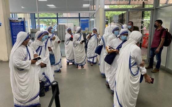 Members of the Missionaries of Charity wait at an immigration office in Penas Blancas, Costa Rica, July 6, 2022, after Nicaragua's government shut down their organization along with other charities and civil organizations. The government on Aug. 19 stripped the legal status of 22 women's religious communities, (OSV News/Sunil Kumar, handout via Reuters)