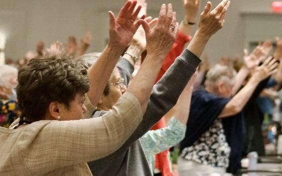 Sisters pray Aug. 15 at the Leadership Conference of Women Religious assembly in Orlando, Florida. (GSR photo/Dan Stockman)