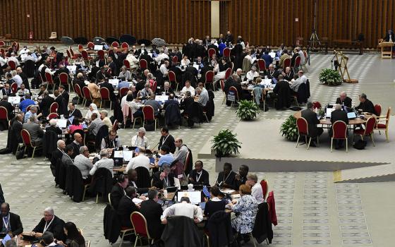 Pope Francis and participants begin a working session of the assembly of the Synod of Bishops in the Vatican's Paul VI Audience Hall, Oct. 13, 2023. (CNS/Lola Gomez)