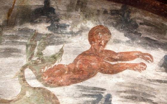 Jonah, the Old Testament prophet, is spit out of the whale in this fresco seen during the unveiling of two newly restored burial chambers in the Christian catacombs of St. Domitilla in Rome May 30, 2017. (CNS/Carol Glatz)