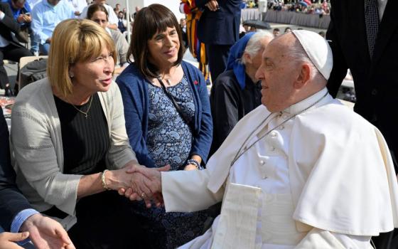 Maureen Rasmussen, left, and Martha Marvel meet Pope Francis in St. Peter’s Square at the Vatican on Sept. 18. They were among four American Catholic trans women who sent the pope a letter describing their lives as Catholics and transgender people before meeting him. (Vatican Media)