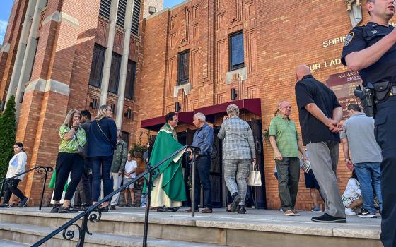Msgr. Jamie Gigantiello, pastor of Our Lady of Mount Carmel-Annunciation Parish, greets parishioners outside Our Lady of Mount Carmel in Brooklyn, New York, Sept. 22. (Sean Piccoli)