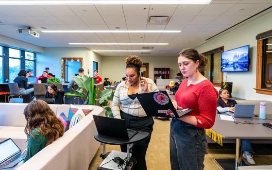 Students work in the Marist Institute for Public Opinion at Marist College in Poughkeepsie, New York. (Marist College/Carlo de Jesus)