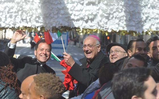 Msgr. Jamie Gigantiello, left, former director of development for the Diocese of Brooklyn, New York, is pictured on a 2016 Columbus Day float in Brooklyn with now retired Brooklyn Bishop Nicholas DiMarzio. (CNS photo/The Tablet/Ed Wilkinson)