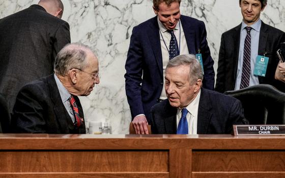 Sen. Chuck Grassley, R-Iowa, left, speaks with Sen. Dick Durbin, D-Ill., before a U.S. Senate Judiciary Committee business meeting to vote on U.S. Supreme Court nominee Judge Ketanji Brown Jackson on Capitol Hill in Washington April 4, 2022. (CNS/Reuters/Michael A McCoy)