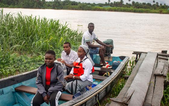 Medical Missionaries of Mary Sr. Janefrances Ihekuna and her team return to a local jetty after their weekly awareness campaign in Fou-Torugbene, a community located 30 minutes by boat from Torugbene, Nigeria, where Ihekuna is administrator for Mary Martin Primary Health Center. They also take health care services to other communities like BlouTamigbe, Isrealiozion, and Akwaware quarter once a month at a subsidized rate. (GSR photo/Valentine Benjamin)