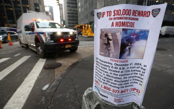 Poster on utility pole, emergency vehicle in background.