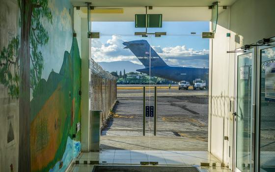 A U.S. military plane carrying Guatemalan migrants deported from the United States sits on the tarmac at La Aurora airport in Guatemala City Jan. 27, 2025. (AP/Moises Castillo)