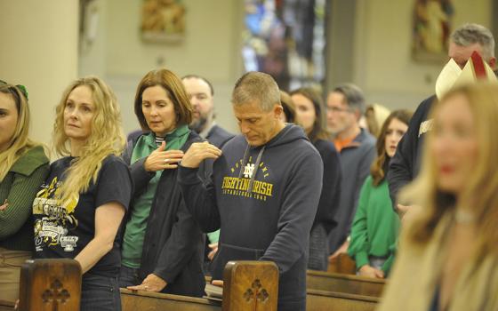 Notre Dame fans attended a Mass Jan. 1, 2025, at St. Louis Cathedral following a truck assault in the French Quarter that killed 15 people and injured three dozen others. Archbishop Gregory Aymond and 600 worshipers struggled to make sense of the death and carnage perpetrated by a man who drove a pickup truck into a dense crowd of early-morning New Year's revelers just five blocks away on Bourbon Street. (OSV News/Clarion Herald/Peter Finney Jr.)