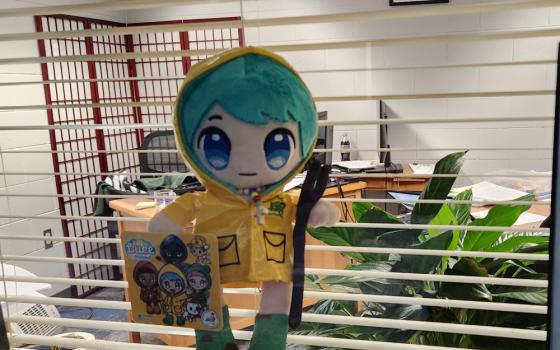 Luce, the 2025 Jubilee Year mascot, adorns the office window of author Jane Marie Bradish.
