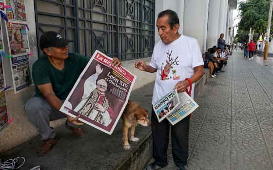 People hold newspapers in Chiclayo, Peru, May 9, 2025, reporting on the election of Pope Leo XIV, who is a dual U.S.-Peruvian citizen. (OSV News/Reuters/Sebastian Castaneda)