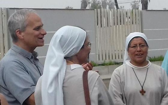The future Pope Leo XIV visits with Augustinian sisters in Peru in this undated photo. As an Augustinian priest, then-Father Robert F. Prevost spent many years as a missionary in Peru and also served as bishop of that country's Chiclayo Diocese. (OSV News/Courtesy of Augustinian Sr. Carmen Toledano)