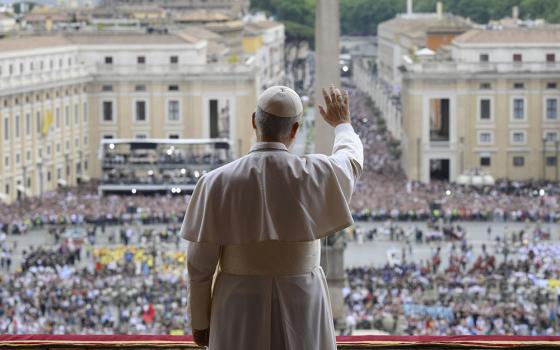 Pope Leo XIV waves to the crowd from the central balcony of St. Peter's Basilica at the Vatican as he leads, for the first time, the midday recitation of the "Regina Coeli" prayer May 11, 2025. (CNS/Vatican Media)