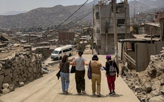 On the way back to the city from Lurigancho, Peru, the road was slippery and dry, but it was fun and safe when we held hands together firmly. Relying one another is such a wonderful practice of liberation theology among women. (Courtesy of Sophia Park)