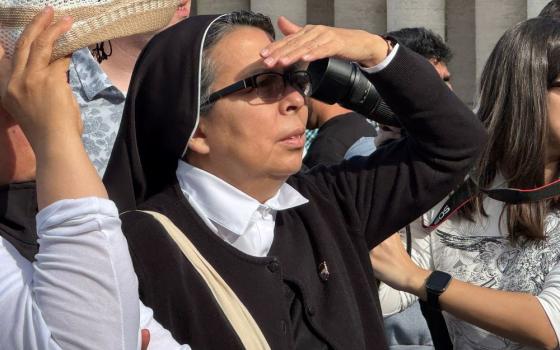 A Latin American sister waits in St. Peter’s Square after white smoke signals the election of a new pope at the Vatican May 8. (GSR photo/Rhina Guidos)