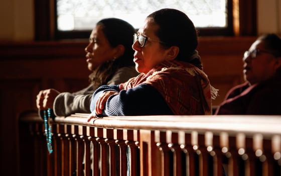 Women pray the rosary before Mass in 2018 at Our Lady of Loretto Church in Hempstead, N.Y. (CNS/Gregory A. Shemitz)