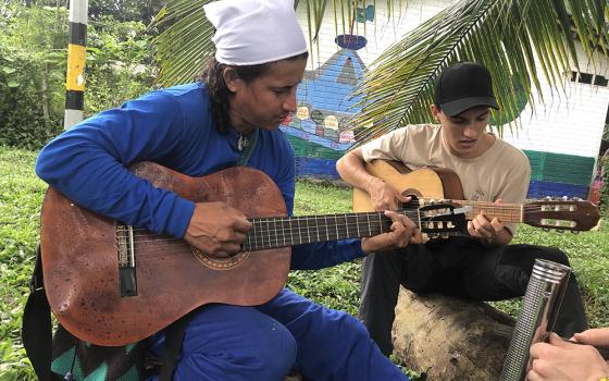 Bladimir Arteaga, or Blacho as he is fondly known, is pictured with Alén, a video producer and GSR collaborator, who is also a musician, on March 25, 2025, at the Peace Community of San José de Apartadó in San José de Apartadó, Colombia. (Tracy L. Barnett)