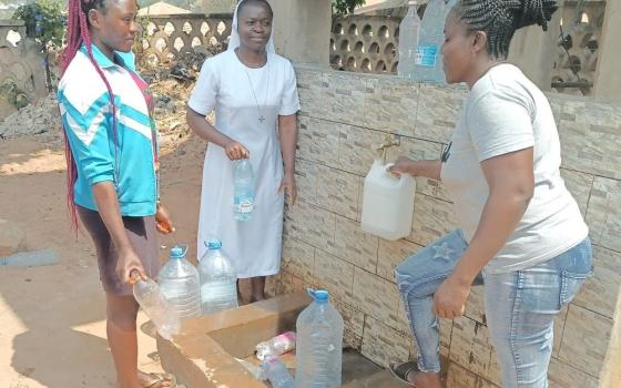 Sr. Kum Shallotte (center), motivated by the need for clean water in the Northwest Region of Cameroon, advocated for and secured a solar-powered borehole for her community. (Courtesy of Kum Shallotte)