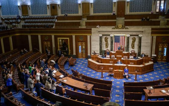 House Minority Leader Hakeem Jeffries, D-N.Y., left, speaks in the House chamber as House Democrats stand to applaud him, prior to the final vote for President Donald Trump's signature bill of tax breaks and spending cuts, at the Capitol, July 3, 2025, in Washington. (AP/Rod Lamkey Jr.)