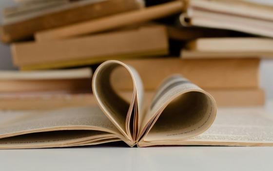 open book, pages forming heart