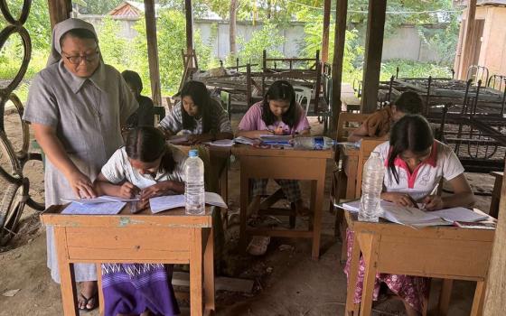 Sr. Roselyn Kay Mg checks on girls studying at the St. Joseph's Orphanage in Zaw Gyi village, Archdiocese of Mandalay, on June 25. Mg is in charge of the orphanage and serves as the superior of the Sisters of St. Joseph of the Apparition. (John Zaw)