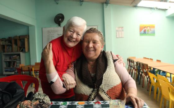Sr. Maritze embraces Cecilia Arenas of the Mothers of Soacha, a longtime friend she calls "una gran luchadora" (a great fighter). 