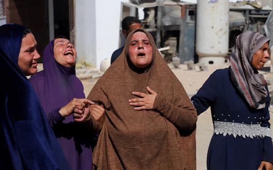 Mourners react during the funeral of Palestinians by Israeli fire who were reportedly trying to receive aid, according to medics, at Al-Shifa Hospital in Gaza City Sept. 11, 2025. (OSV News/Reuters/Ebrahim Hajjaj)