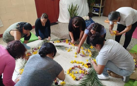Women create a flower mandala as a symbol of gratitude for beginning their psycho-spiritual accompaniment process. (Flight in V Formation)