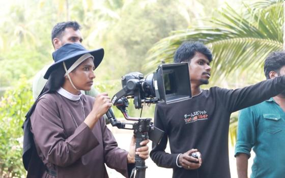 Sr. Lismy Parayil with her camera during a film shoot. (Courtesy of Lismy Parayil) 