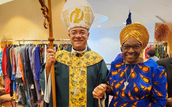 Sr. Jannette Pruitt and Archbishop Shelton Fabre of Louisville, Kentucky. Pruitt designed and created her dress, as well as Fabre's vestments. (Courtesy of Jannette Pruitt)