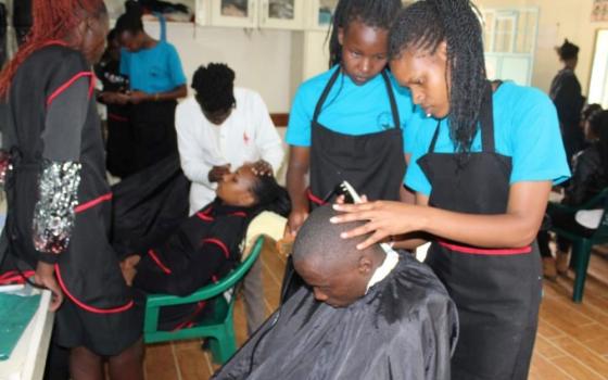 Hairdressing and beauty therapy students participate in a lesson at the Euphrasia Vocational Training Institute, a project of the Sisters of Our Lady of the Good Shepherd in Ngong, Kenya.  (Courtesy of Justicia Nekesa)