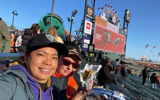 Sr. Nodelyn Abayan, left, and Sr. Celeste Arbuckle attend a San Francisco Giants game April 8. (Nodelyn Abayan)