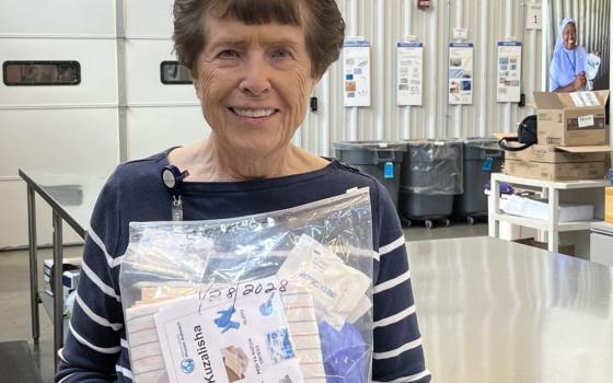 Sr. Ritamary Brown holds a clean birth kit at Hospital Sisters Mission Outreach. (Courtesy of Ritamary Brown) 