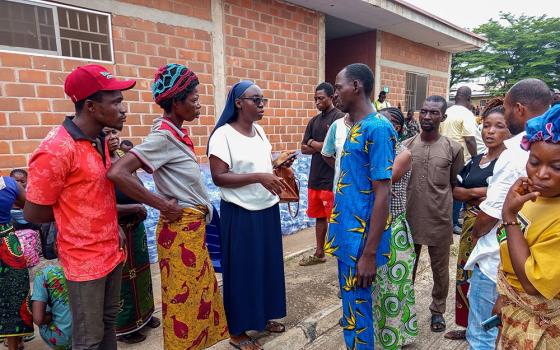 Sr. Mary Ojonugwa Unwuchola interacts with survivors at the International Market Camp for internally displaced people in Makurdi, Benue State, Nigeria. Unwuchola listens to survivors' concerns, prays with them, offers encouragement, and spends time with them, giving them hope for a better tomorrow. (John Chukwu)