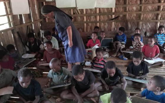 The Cluny sisters offer literacy and education programs for local children in Papua New Guinea. Education was unavailable when the sisters first arrived, so they started a school. Once the students were ready, they were trained as teachers, and they now teach in the 12 schools. (Courtesy of Sylvian Aua)