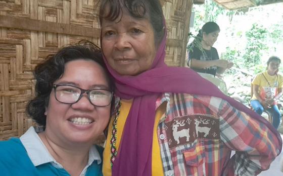 Petite Lao, left, and longtime friend Samidan, a Menubu Dulangan elder and knowledge keeper, are pictured in December 2024 in Kulamana — a remote Indigenous municipality in Mindanao, now known as Senator Ninoy Aquino in the Philippines. Lao consults her friend for education about Menubu Dulangan culture, especially their dances and stories. (Courtesy of Patricia Lourdes (Petite) Navarra Lao)