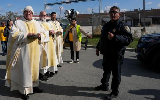 Law enforcement officers prevent clergy from entering the Broadview ICE facility and offering Communion to immigrants detained inside, during an outdoor Mass in the Broadview section of Chicago Nov. 1. (OSV News/Leah Millis, Reuters)
