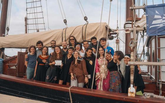 A group of young participants in the final stage of the Bel Espoir voyage poses with Sr. Abir Hanna, coordinator of the network of monasteries that accompanied the youth. (Courtesy of Jesús Marro Sanz)