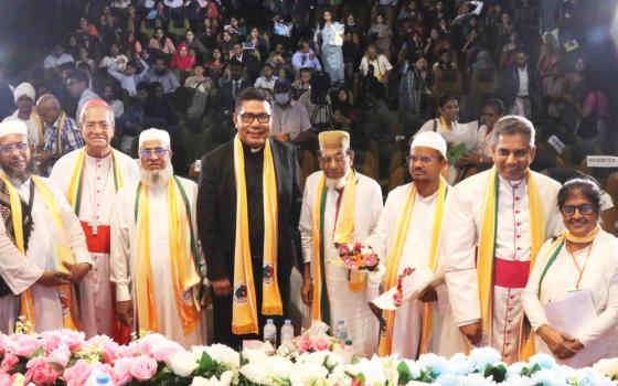 Sr. Reba Veronica D'Costa poses for a photo with Dhaka Cardinal Patrick D'Rozario (second from left), a team from the Vatican and other religious scholars on Sept. 7 in Dhaka. (Stephan Uttom Rozario) 