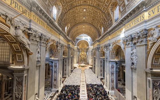 Deacons vested in white with their families and the public behind them attend a diaconate ordination Mass in St. Peter's Basilica celebrated during the Jubilee of Deacons at the Vatican Feb. 23, 2025. (CNS/Pablo Esparza)