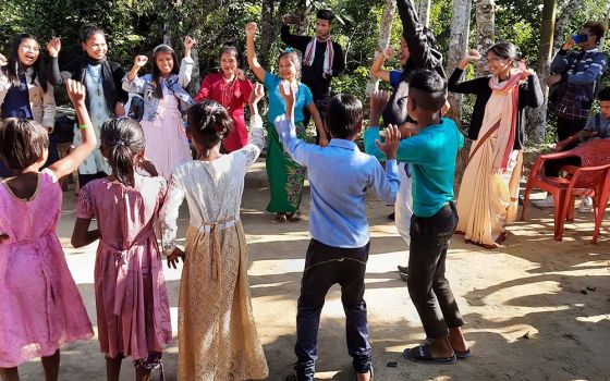 Sister Leema leads a dance, assisted by children who are boarders and joined by children of the village of Ratanpur, North-Eastern India, during Christmas 2020. (Courtesy of Frida Toppo)