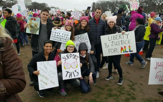 The Women's March, held in a number of cities around the U.S. in January 2017, kicked off a new wave of protests that have spanned President Donald Trump's first term. Katie Killpack, is pictured third from right, standing at the march in Washington, D.C.