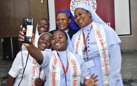 Sr. Agatha Chikelue, top row center, poses with participants in the Fellowship Program of the Cardinal Onaiyekan Foundation for Peace at their June graduation in Abuja, Nigeria. (Courtesy of Stephen Udama)