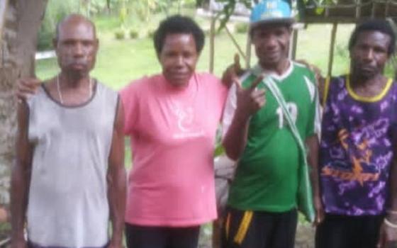 Imelda Suyai, a Sister of Presentation of the Blessed Virgin Mary, pictured with three of her four brothers, grew up in a rural village in Papua New Guinea. Her parents were subsistence farmers. (Courtesy of Sr. Imelda Suyai)