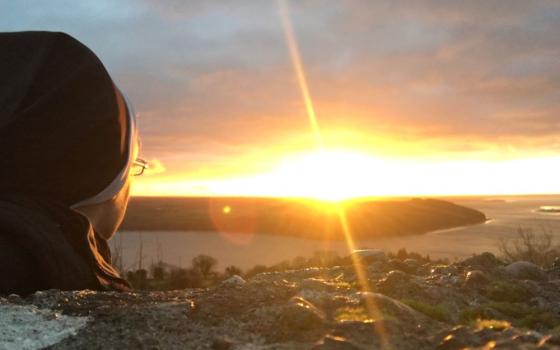 The author looks at the sunrise over Ireland's County Wexford and the River Barrow in January 2022. (Kathryn Press)